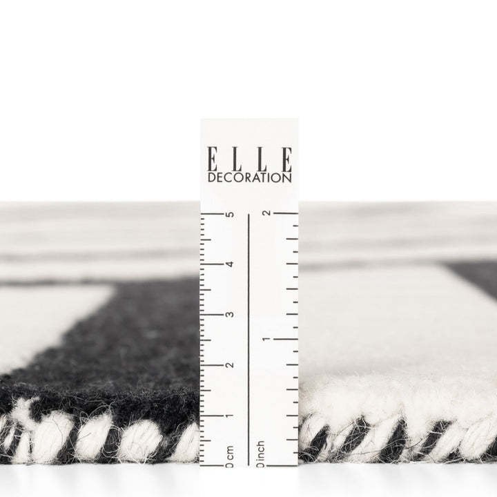 Rug with zebra pattern measurement against a white background