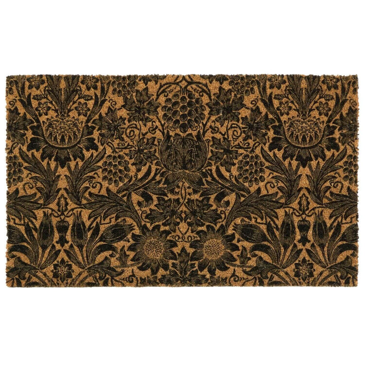 Floral patterned doormat with black design on a beige background