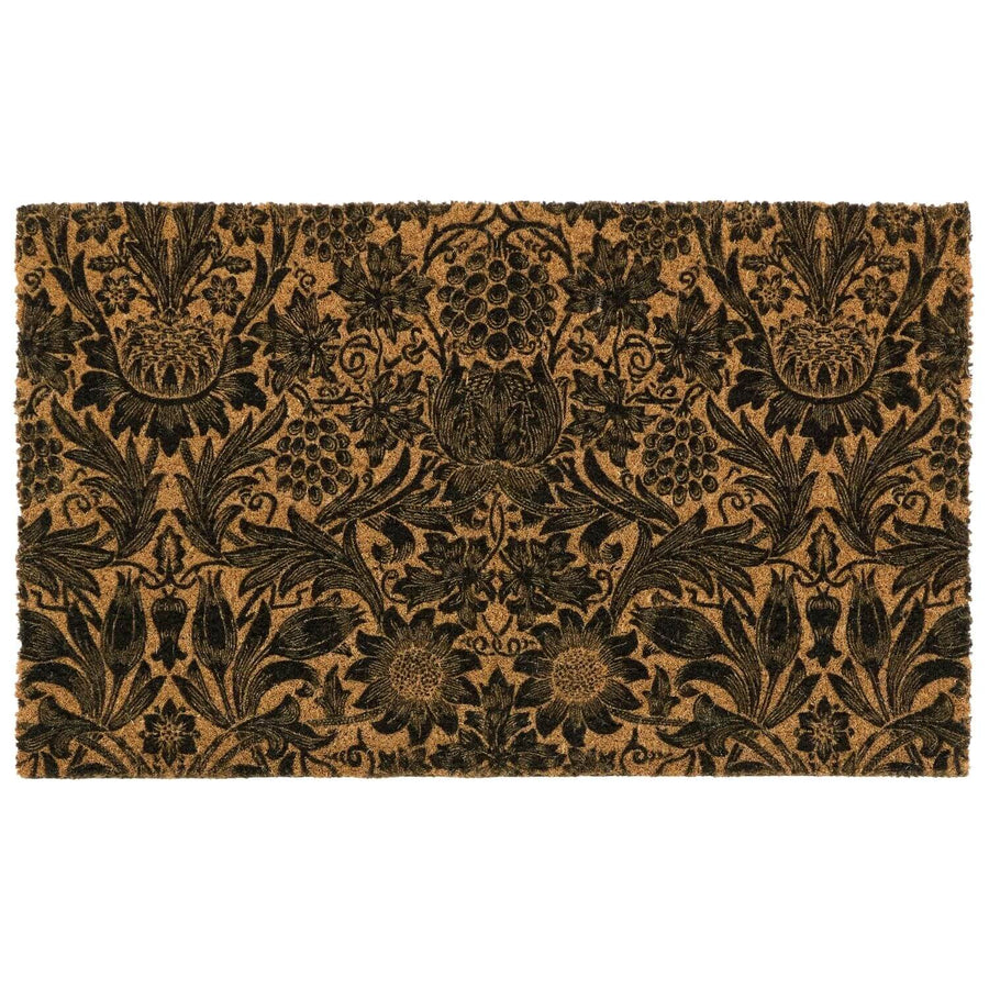 Floral patterned doormat with black design on a beige background