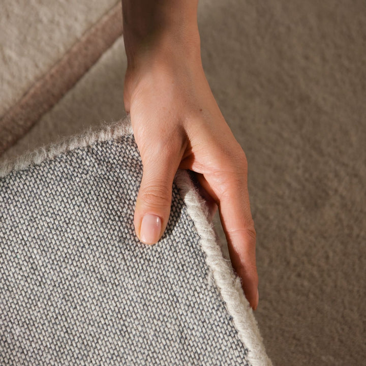 Pure wool rug, cream beige colours, cotton backing, cosy warmth, hand-crafted.