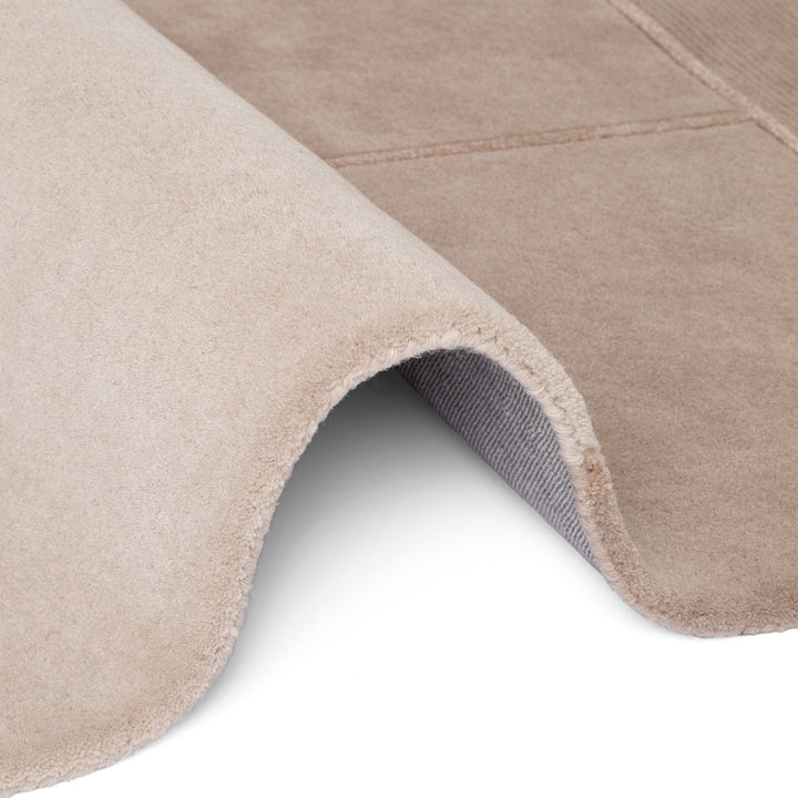 Pure wool rug, cream beige colours, cotton backing, cosy warmth, hand-crafted.