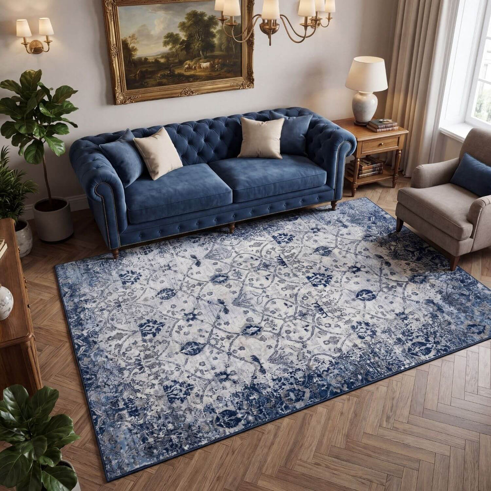 Living room with a blue sofa and patterned rug