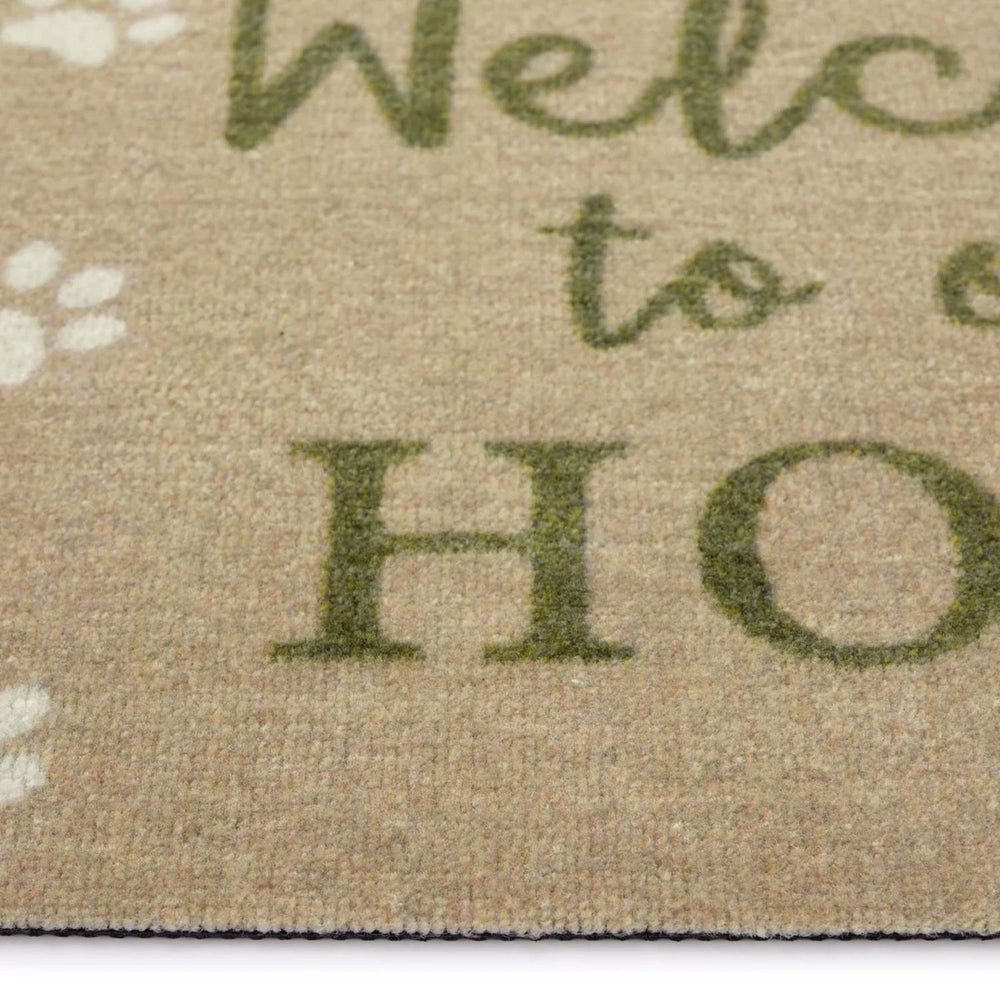 Doormat with 'Welcome to our Home' text and paw prints on a beige background