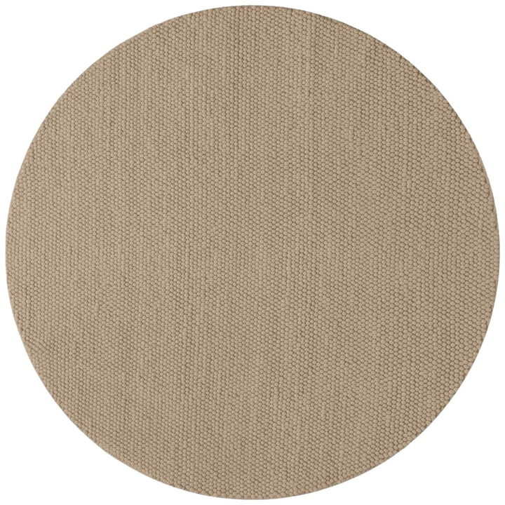 Round beige rug with a textured pattern on a white background