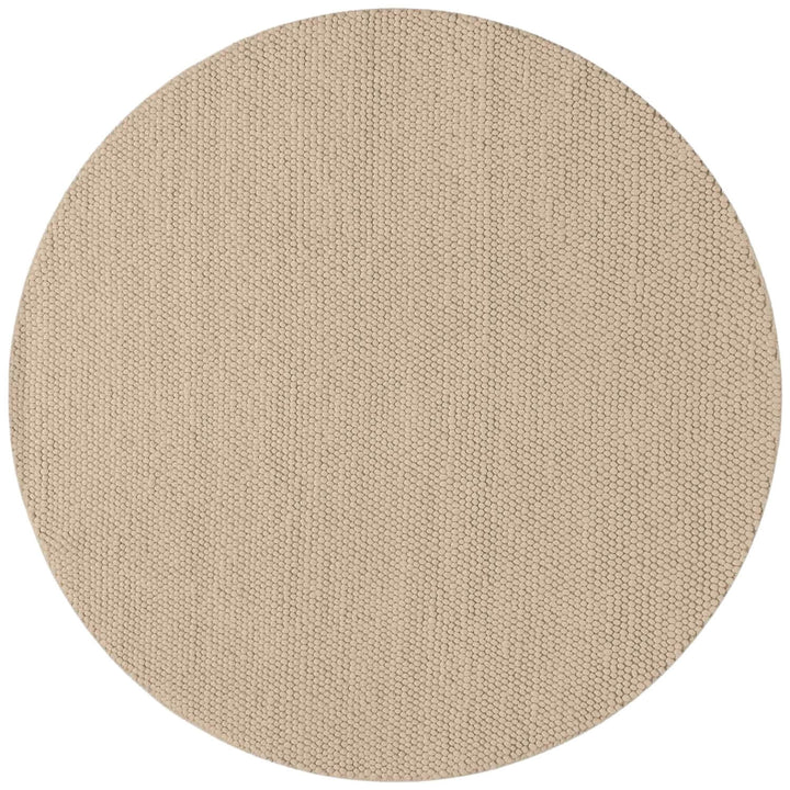 Beige round rug on a white background