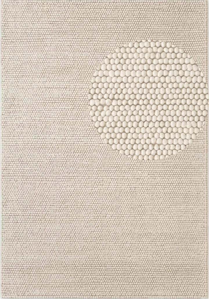 Textured beige rug with a circular pattern