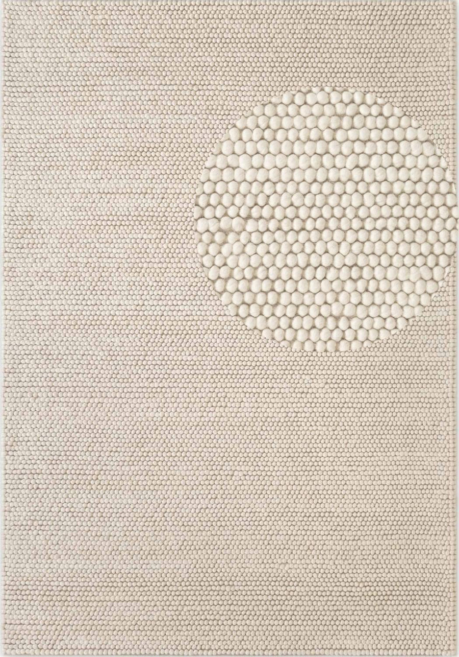 Textured beige rug with a circular pattern