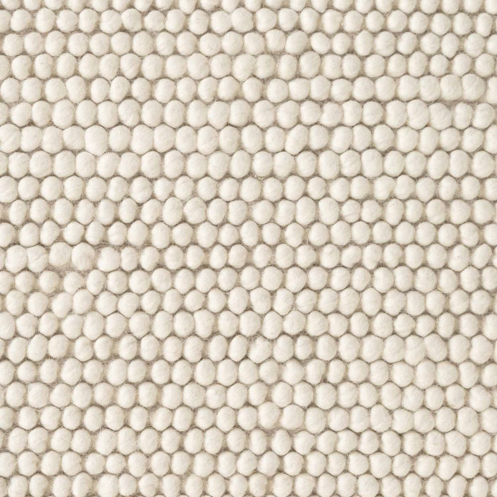 Close-up of textured beige fabric with a pattern