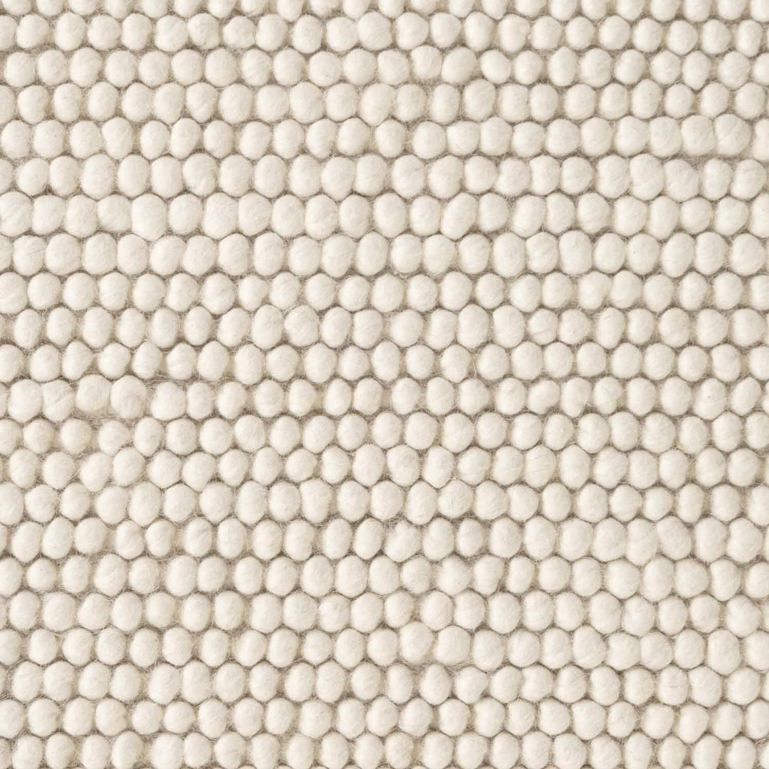 Close-up of textured beige fabric with a pattern