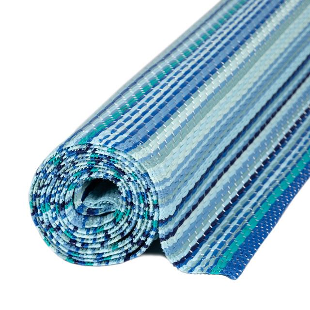 Rolled blue Rainbow Outdoor Rug with bold striped geometric patterns, perfect for vibrant and stylish outdoor decor.