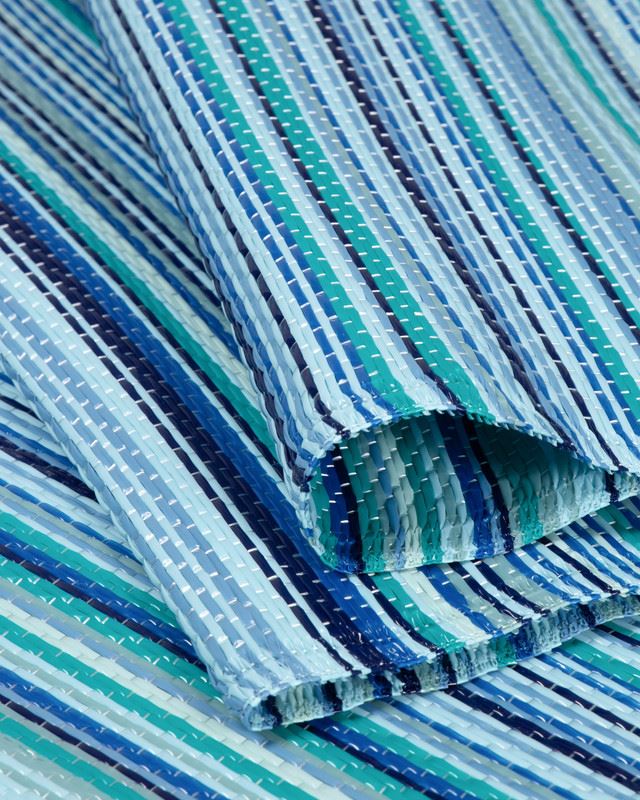 Vibrant blue striped Rainbow Outdoor Rug with durable fabric, ideal for enhancing outdoor decor with modern geometric patterns.