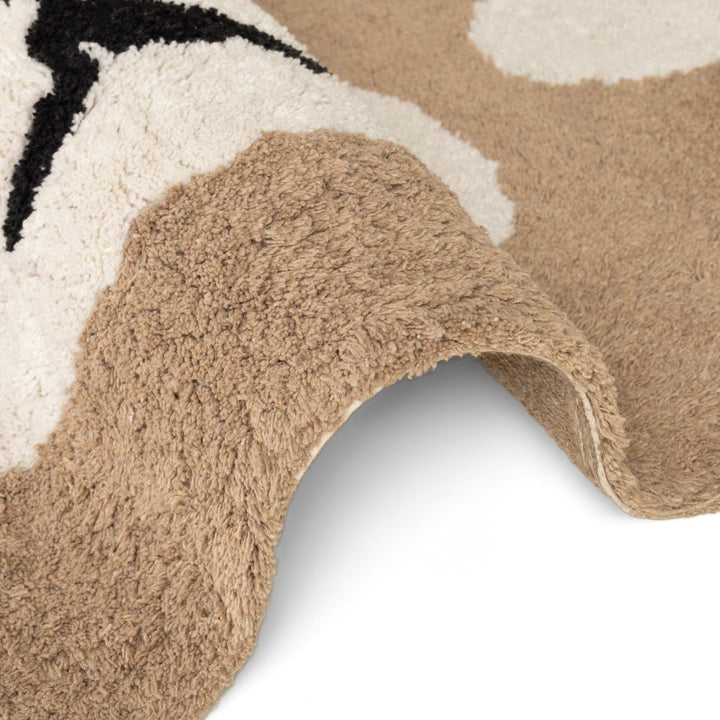 Close-up of a textured rug with geometric pattern on a white background