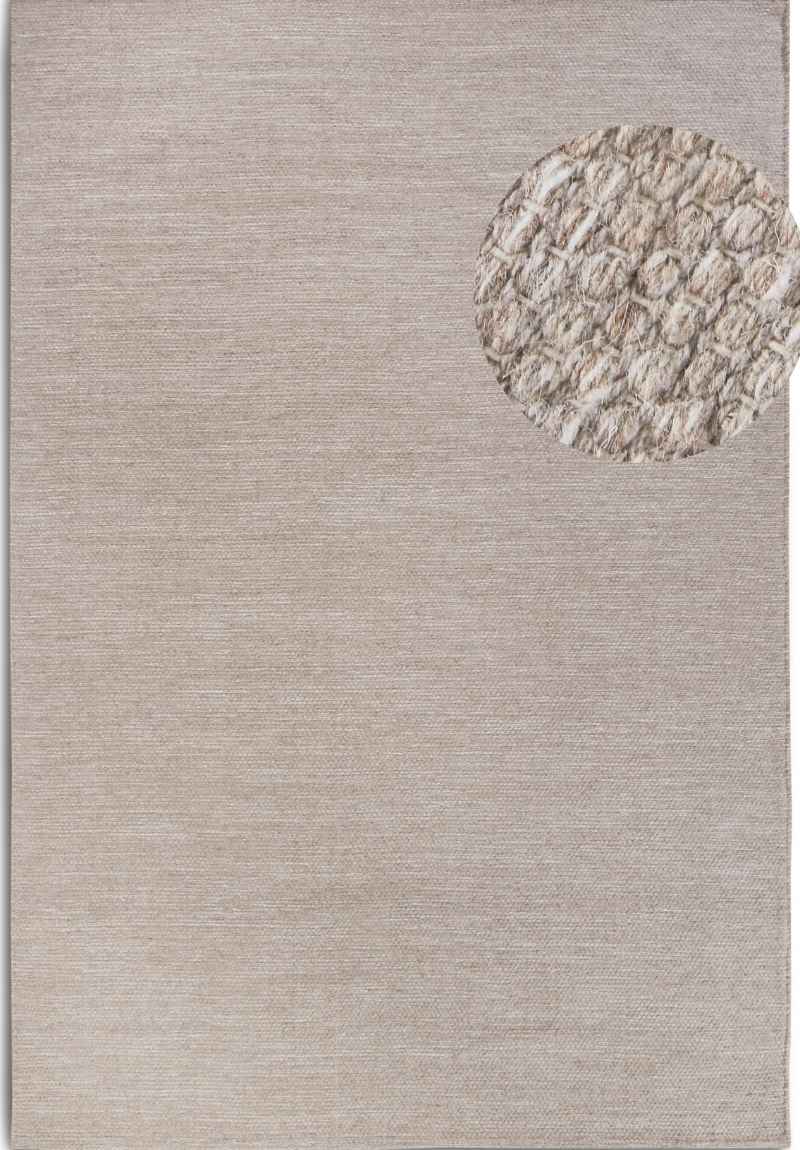 Textured area rug with a circular pattern on a neutral background