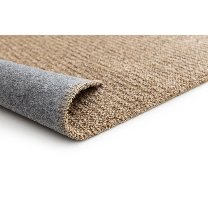 Dune Boucle beige textured rug, corner folded back to show the soft felt backing | The Rugs