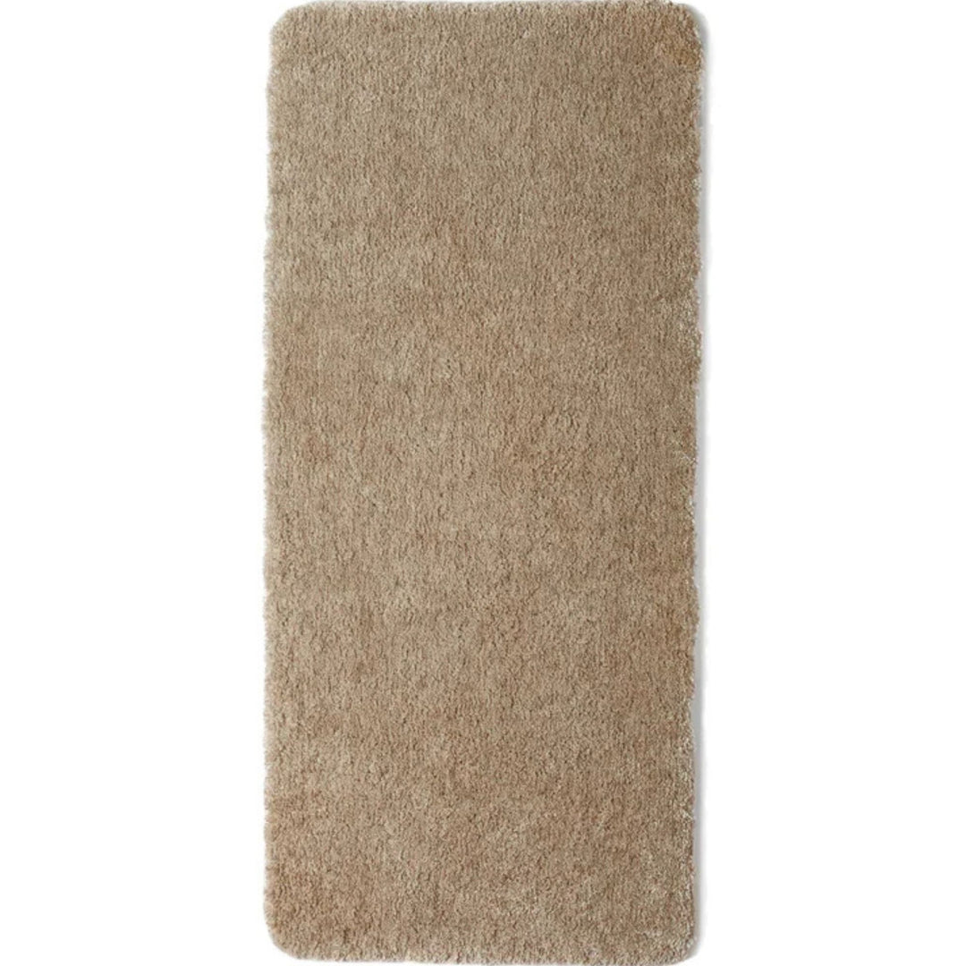 Beige washable shaggy runner in a hallway