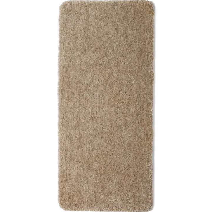 Beige washable shaggy runner in a hallway