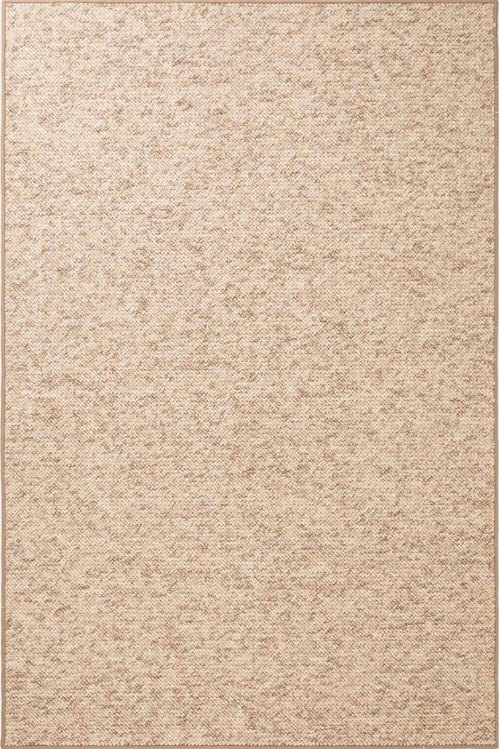 Beige textured area rug with a subtle pattern