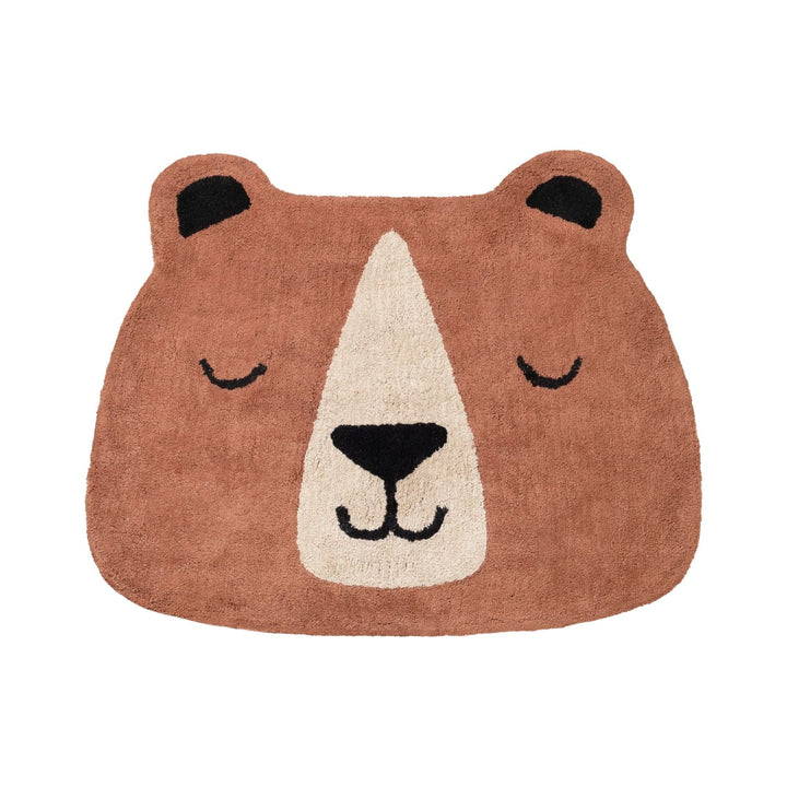 Bear-shaped rug with a smiling face on a white background