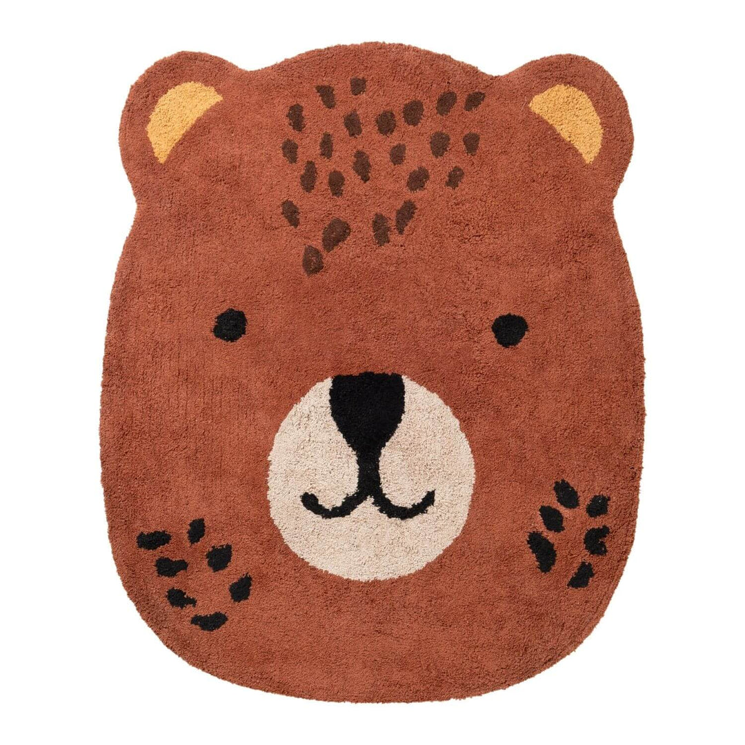 Bear-shaped rug with brown fur, black eyes, and a white muzzle on a white background