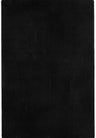 Black plain rug with a soft short pile in a living room