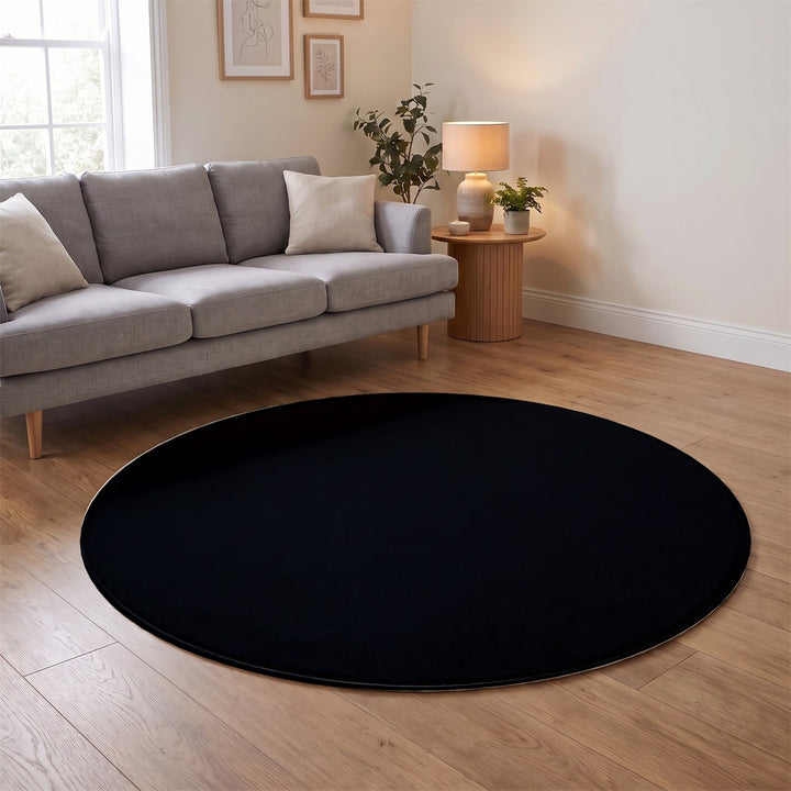 Washmellow black round washable rug in a living room | The Rugs