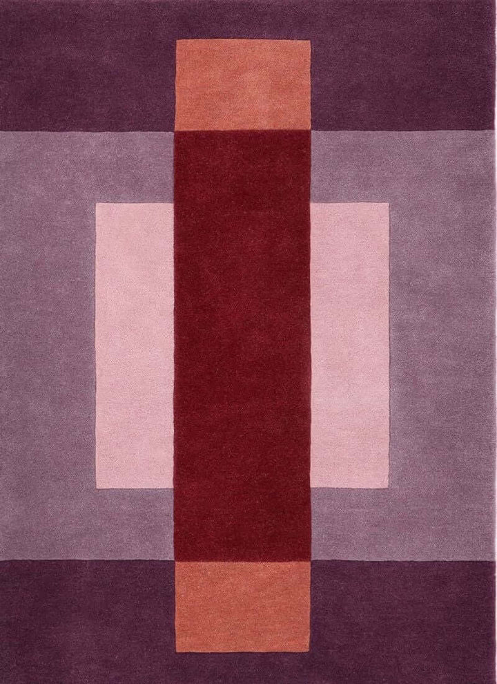 Hand-carved multicoloured geometric wool rug featuring a bold block design, perfect for modern interiors.
