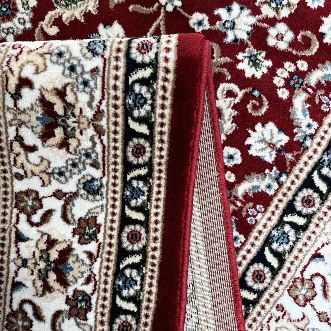 Close-up of a patterned rug with intricate designs and vibrant colors.