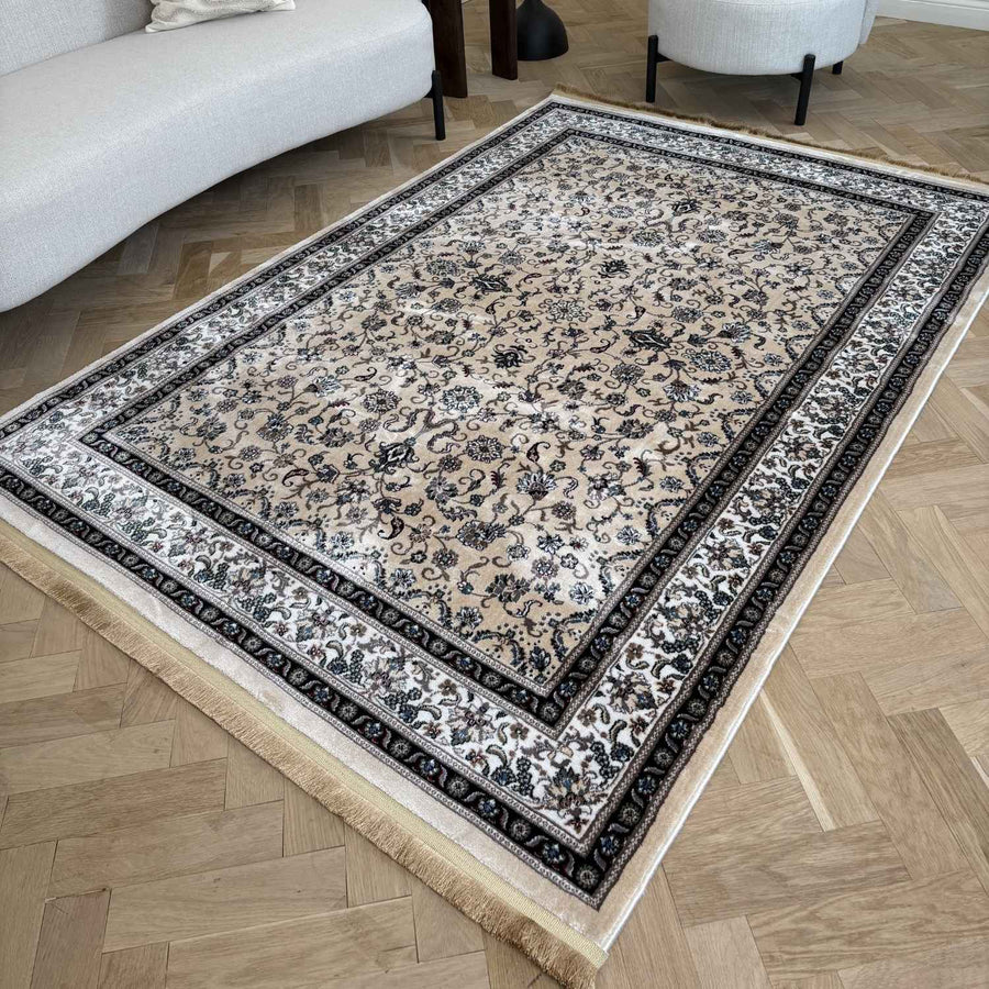 Decorative rug with intricate patterns on a wooden floor