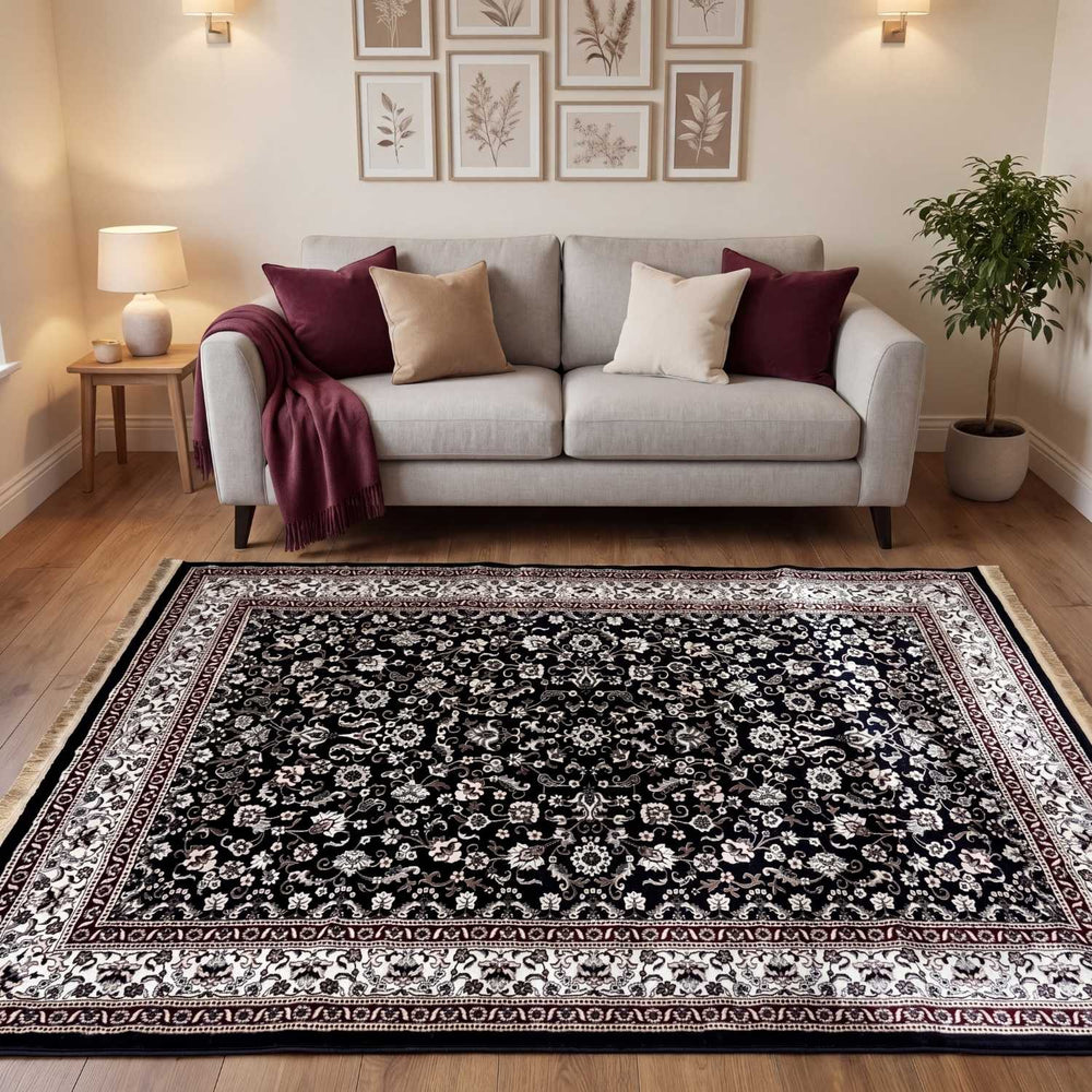 Living room with a patterned rug, sofa, and decorative elements.