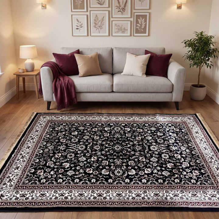 Living room with a patterned rug, sofa, and decorative elements.