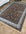 Decorative rug with intricate patterns on a wooden floor