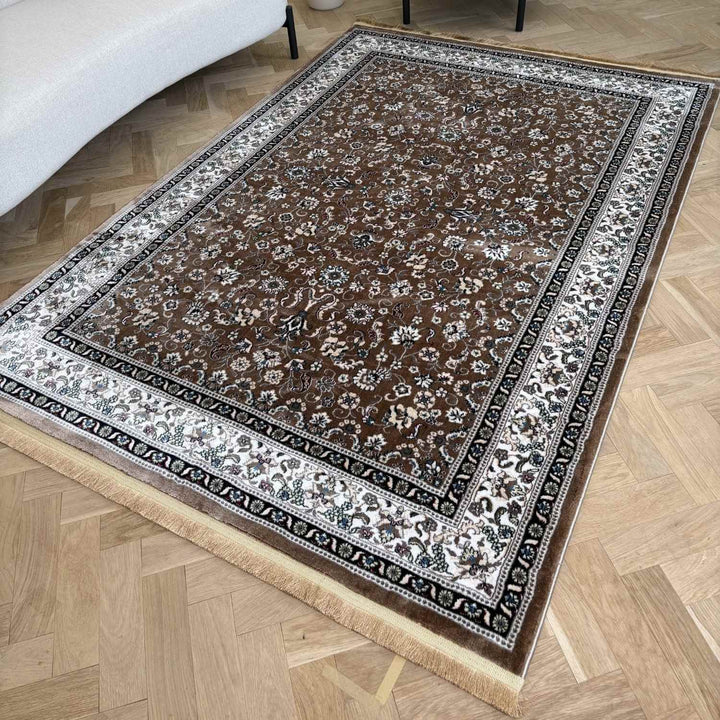 Decorative rug with intricate patterns on a wooden floor