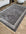 Decorative rug with intricate patterns on a wooden floor