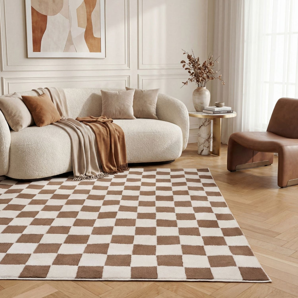 Modern living room with a checkered rug, beige sofa, and brown chair.