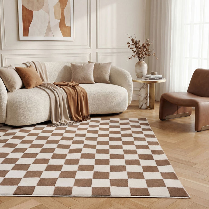 Modern living room with a checkered rug, beige sofa, and brown chair.