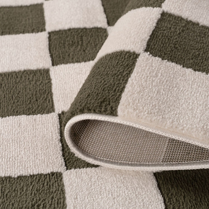 Close-up of a checkered patterned rug with a focus on the edge.