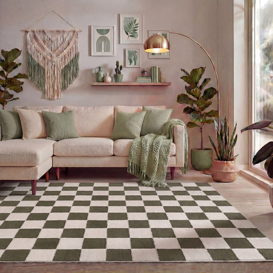 Living room with a beige sectional sofa, checkered rug, and decorative plants.