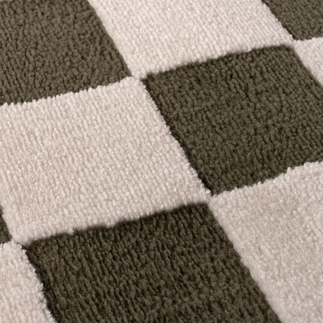 Close-up of a checkered pattern with alternating dark and light squares.