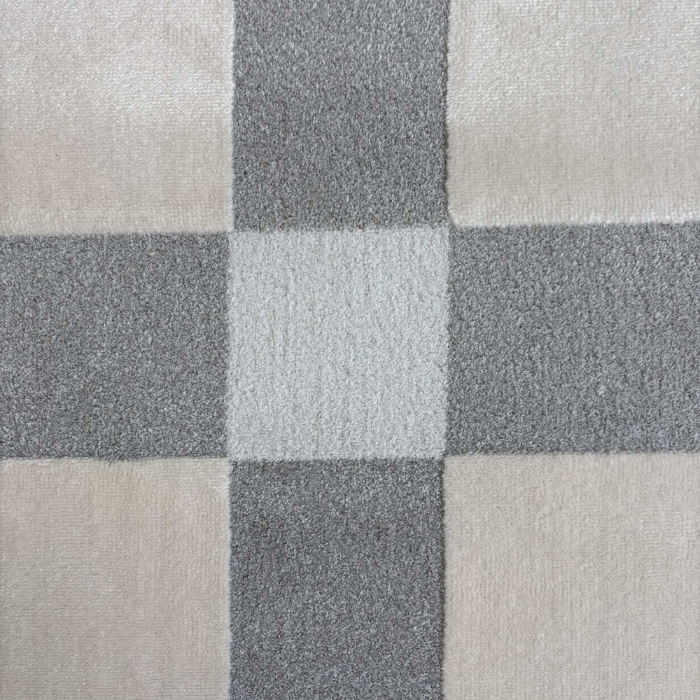 Close-up of a checkered pattern with shades of gray and beige.