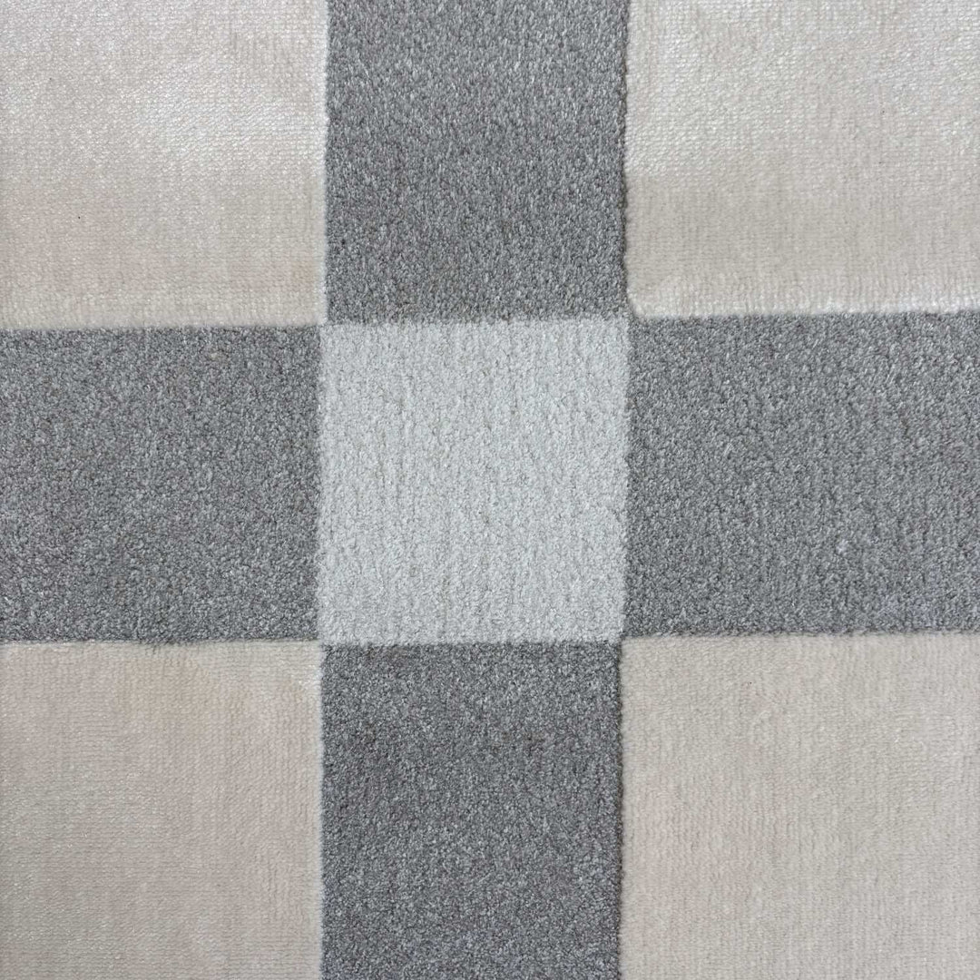 Close-up of a checkered pattern with shades of gray and beige.