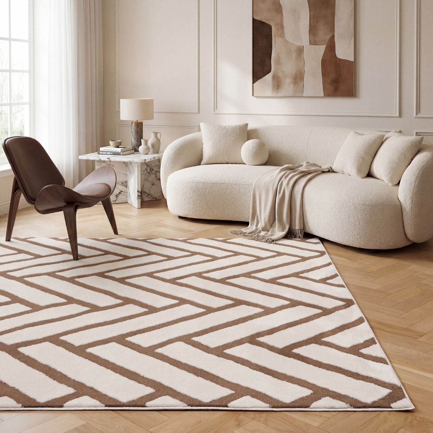 Modern living room with a patterned rug, sofa, and chair.