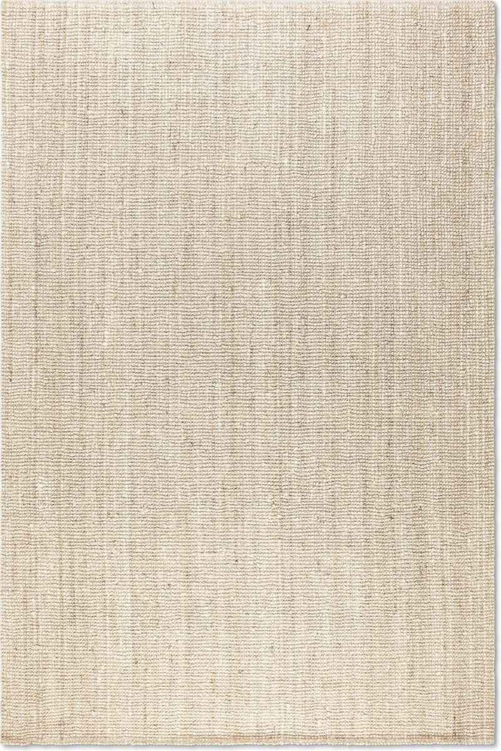 Beige area rug with a textured pattern on a white background