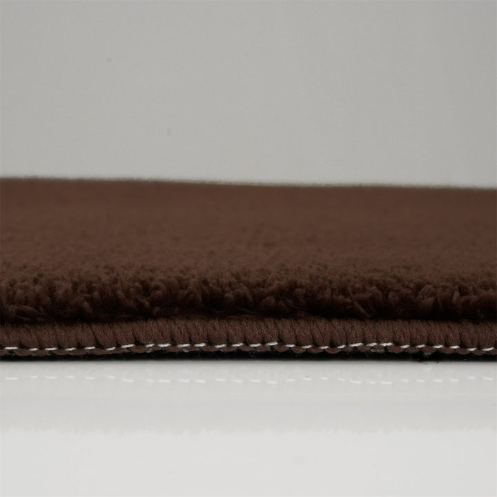Washmellow dark brown washable rug, side view of the low pile and edge at floor level | The Rugs