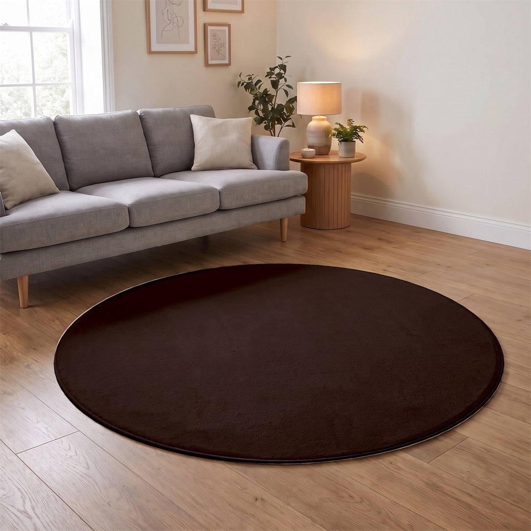Washmellow dark brown round washable rug in a living room | The Rugs