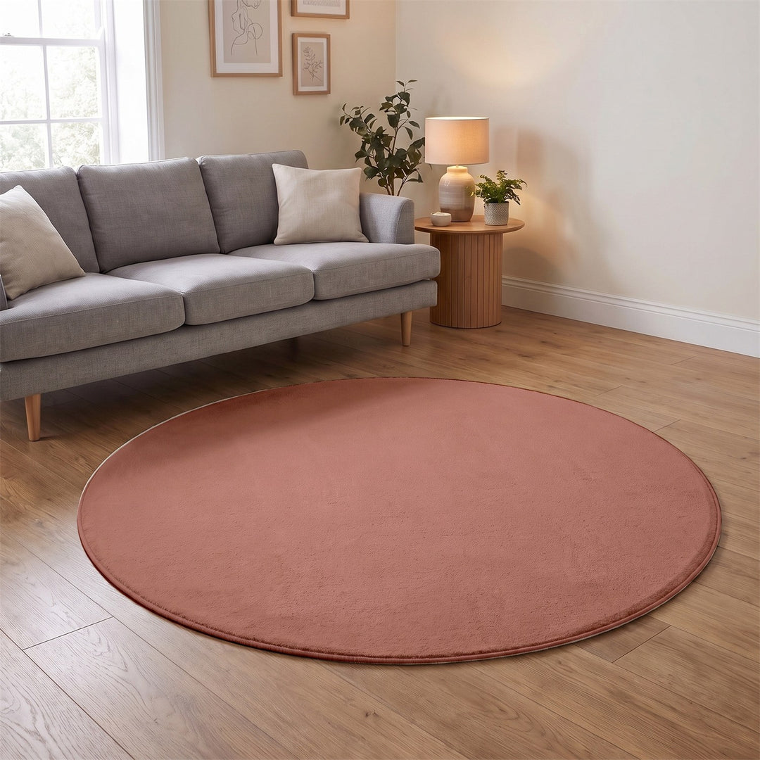 Washmellow dark pink round washable rug in a living room | The Rugs