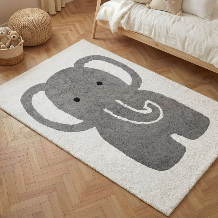 Children's rug with an elephant design on a wooden floor