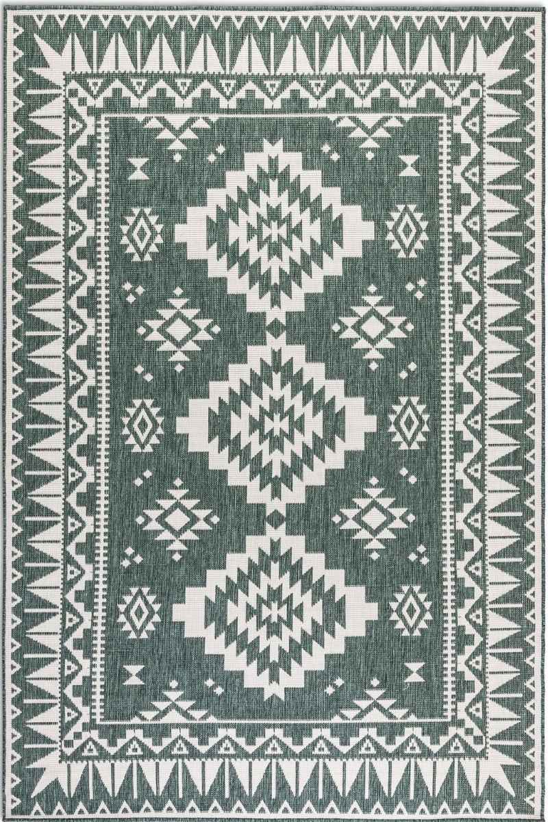 Rug with geometric pattern on a green background