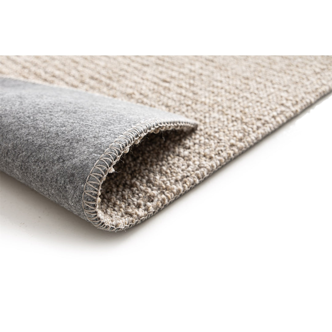 Dune Boucle greige textured rug, corner folded back to show the soft felt backing | The Rugs