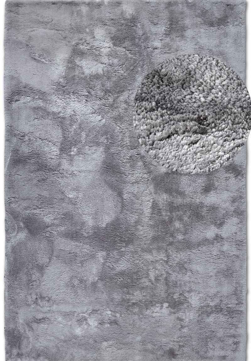 Gray textured area rug with abstract patterns