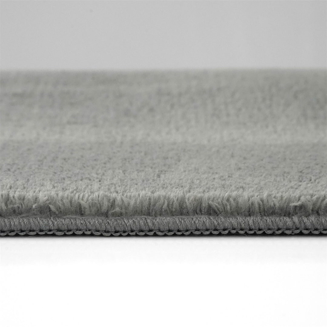 Washmellow grey washable rug, side view of the low pile and edge at floor level | The Rugs